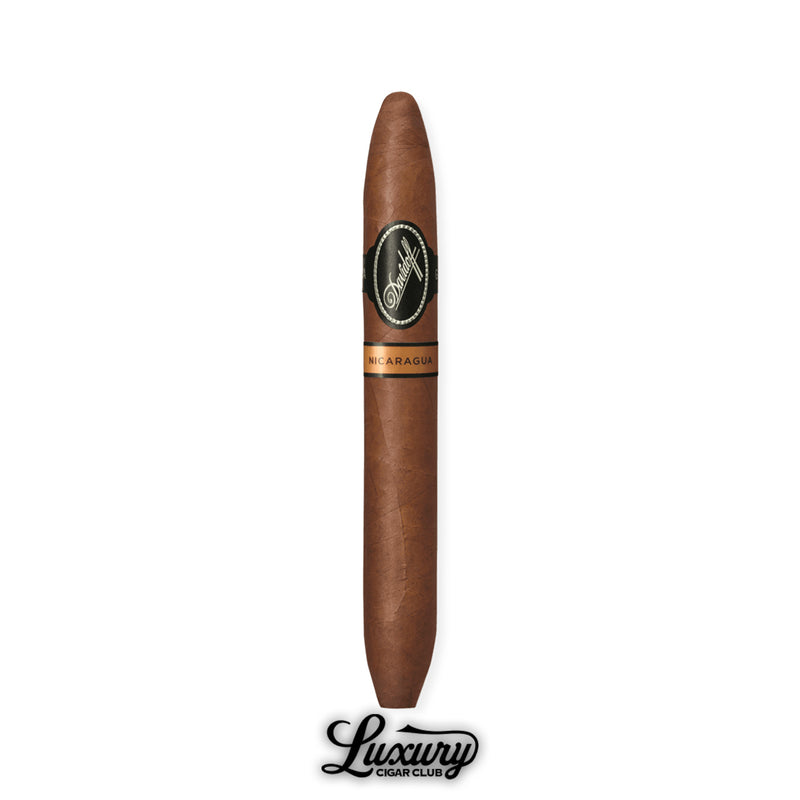 A single Davidoff Nicaragua Diadema cigar with its signature double-tapered ends, dressed in a smooth, oily Habano wrapper. The black-and-gold Davidoff band highlights its refined presentation, shown with the Luxury Cigar Club logo beneath.