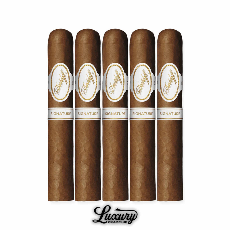 Five Davidoff Signature 6000 cigars arranged in a row, medium brown Connecticut-wrapped with refined white and gold Davidoff bands, showcased above the Luxury Cigar Club logo.