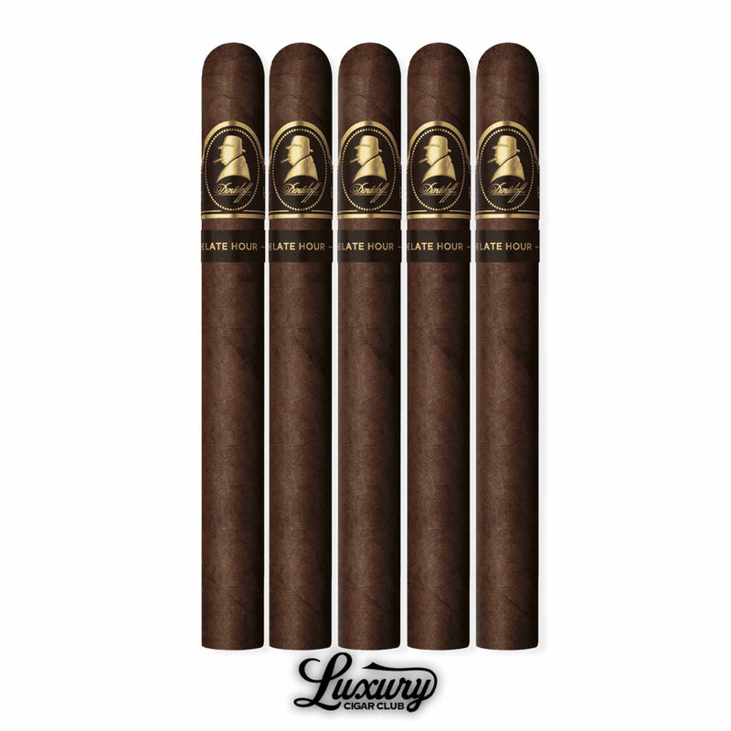 Five Davidoff Winston Churchill Late Hour Churchill cigars, long format, showcasing dark oily wrappers and striking black and gold bands with Winston Churchill’s silhouette, presented in a vertical row with the Luxury Cigar Club logo at the bottom.