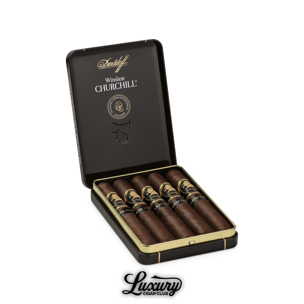 Open tin of Davidoff Winston Churchill The Late Hour Petit Panetela cigars with black and gold bands, displayed by Luxury Cigar Club.
