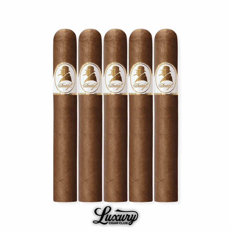 Davidoff Winston Churchill The Original Series Petit Corona cigars in a 5-pack bundle, highlighting their smaller size, sleek light brown wrappers, and iconic white and gold Churchill silhouette band, Luxury Cigar Club presentation.