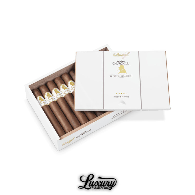 Box of Davidoff Winston Churchill The Original Series Petit Corona cigars, sleek white packaging with gold silhouette branding, showing neatly arranged cigars inside, with Luxury Cigar Club logo at the bottom.