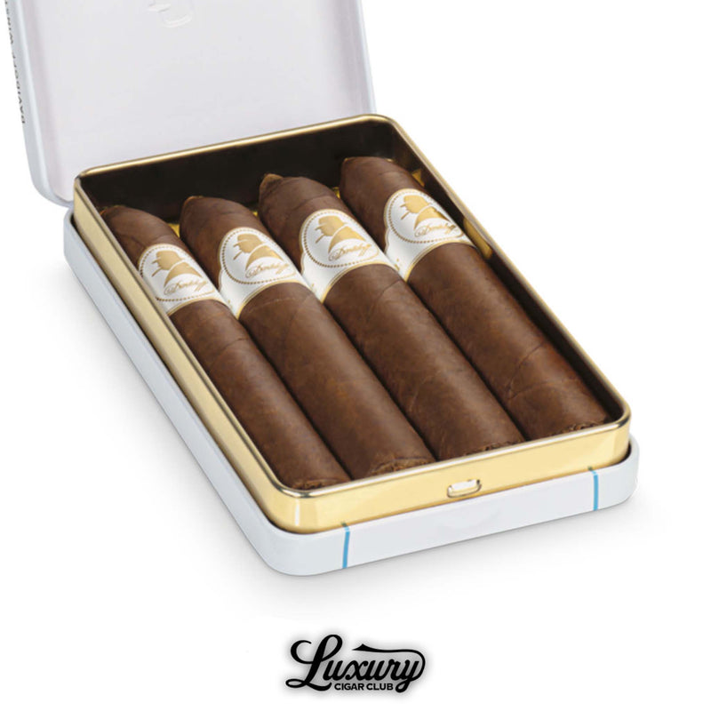 Close-up of Davidoff Winston Churchill Belicoso cigars with pointed heads inside an open tin box
