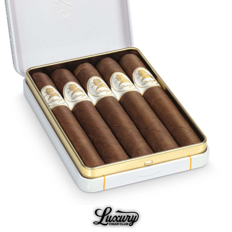 Close-up view of Davidoff Winston Churchill Petit Panatela cigars in an open white and gold tin