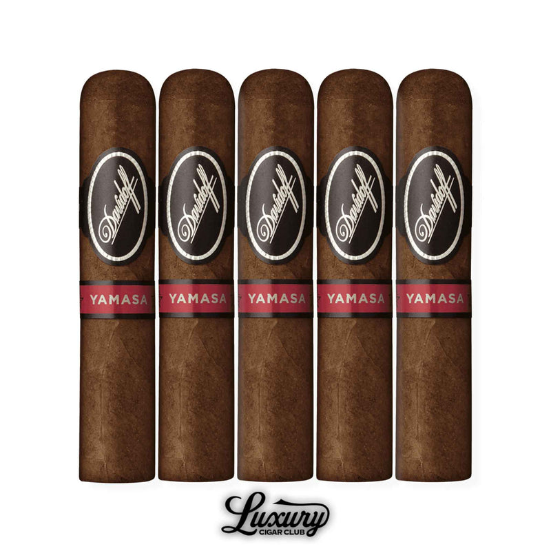 Five Davidoff Yamasa Petit Churchill cigars with dark brown wrapper leaves, each featuring the black and silver Davidoff band and red Yamasa band, displayed in a row with the Luxury Cigar Club logo beneath.