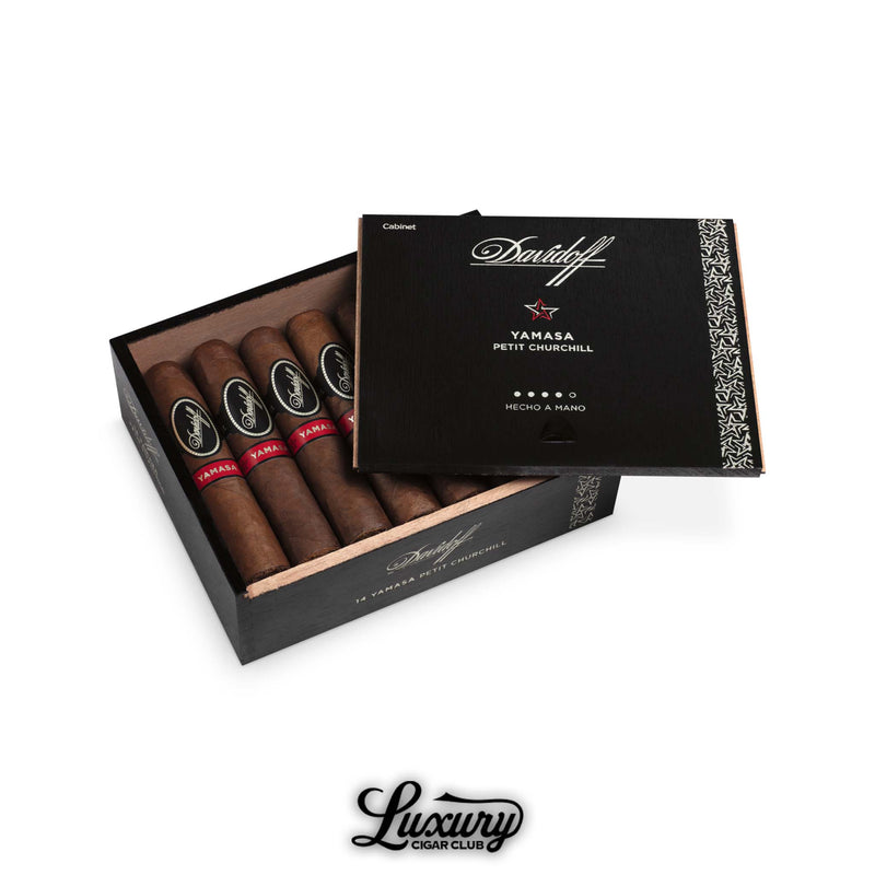 Open black box of Davidoff Yamasa Petit Churchill cigars with red bands, partially covered by branded lid.