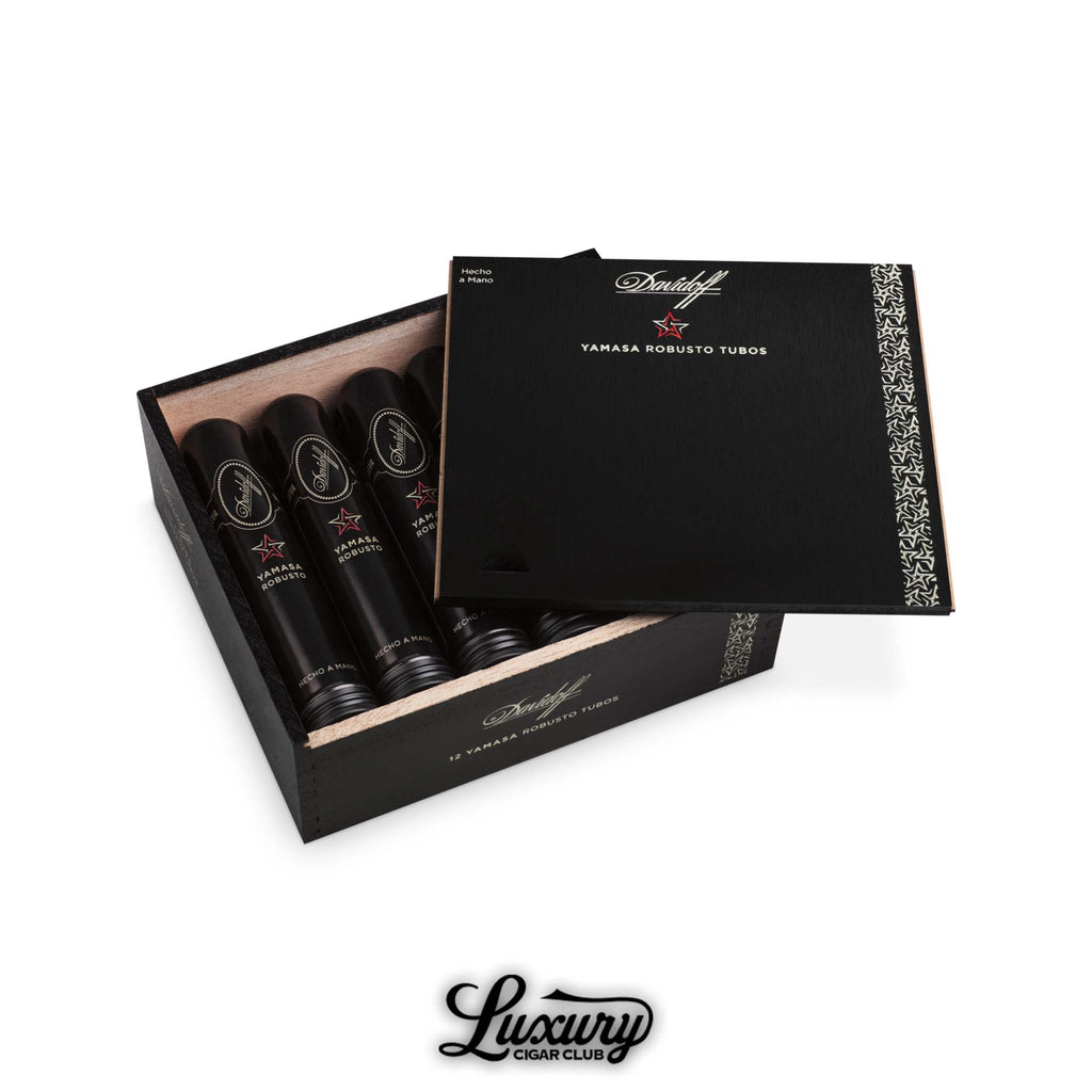 Open box displaying Davidoff Yamasa Robusto cigars in black aluminum tubes with matching box lid.