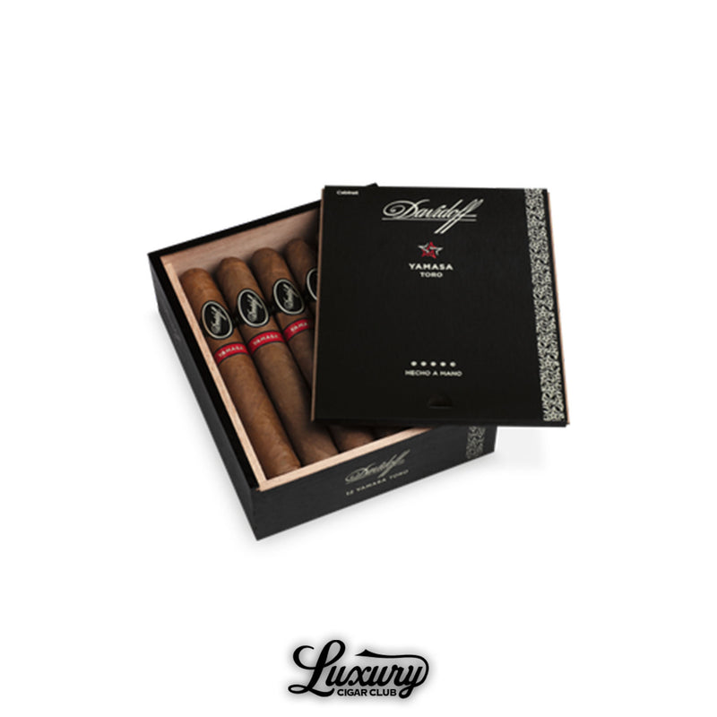 Open box of Davidoff Yamasa Toro cigars with bold red Yamasa bands and elegant black packaging.