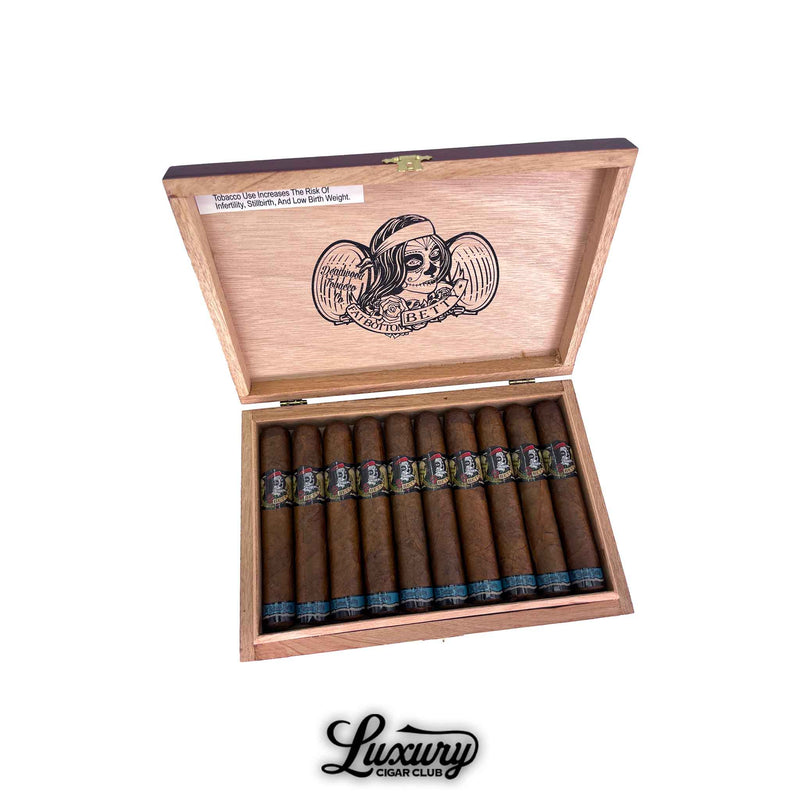 Open wooden box of Deadwood Tobacco Co. Fat Bottom Betty Robusto cigars, showing full bundle inside with skull-themed cigar bands, Luxury Cigar Club logo at bottom.