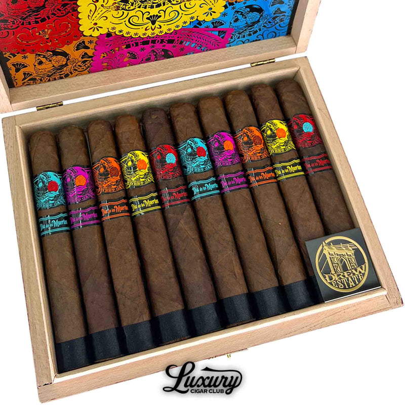 Close up of Luxury Cigar Club Deadwood Sweet Jane Día de los Muertos 2025 limited edition toro cigars showing detailed cigar bands and colorful box interior.