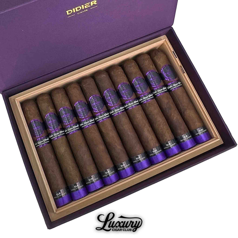Close-up of Didier Elie Modulo Marqués cigars in an open purple box with cedar lining, featuring dark brown wrappers and purple foot bands, from Luxury Cigar Club.