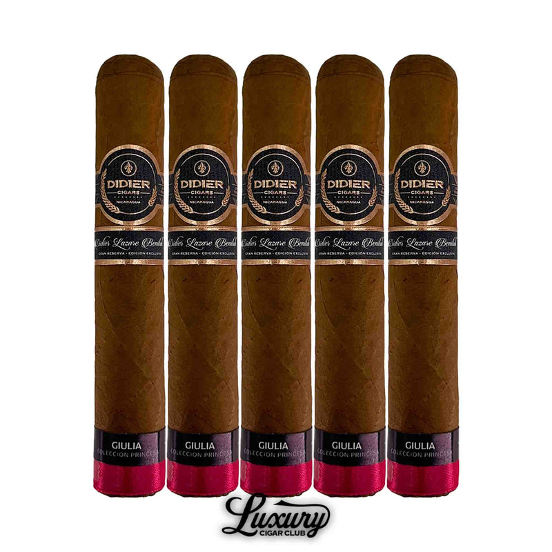Close-up of five Didier Giulia Serie Colección Princesa cigars with light brown wrappers, pink foot bands, and black-and-gold main bands.