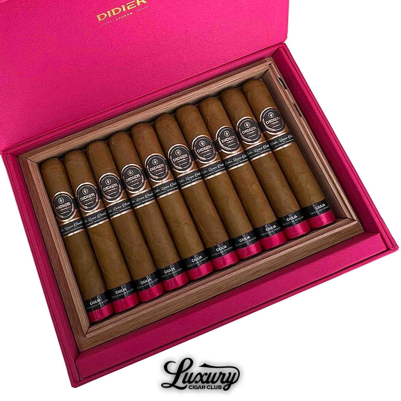 Close-up of Didier Giulia cigars in pink box with black and silver bands – Luxury Cigar Club branding.