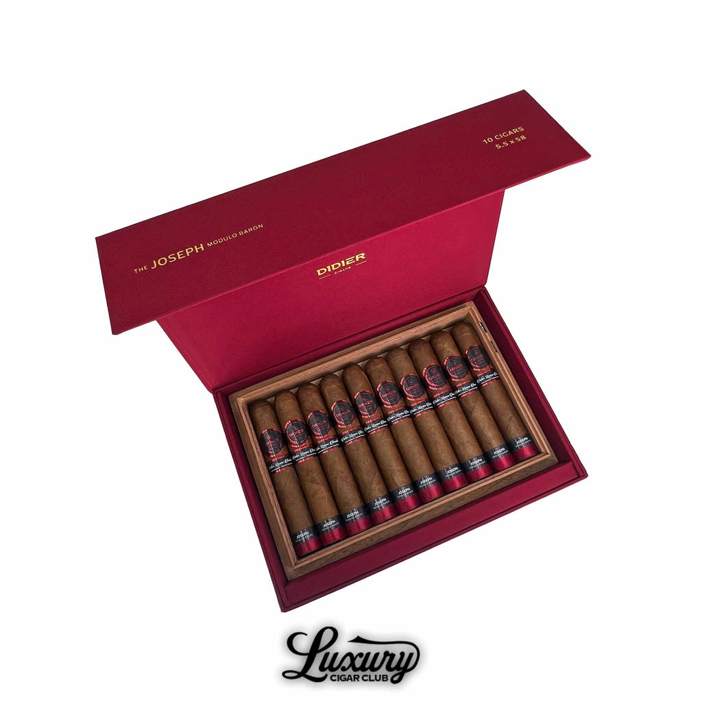 Open red Didier Joseph cigar box displaying 10 premium cigars with black and red bands, arranged neatly in a cedar-lined interior.