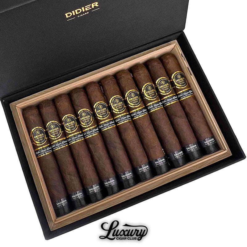 Close-up view of Didier Salomon Serie Del Rey cigars showing rich brown wrappers and detailed gold and black cigar bands inside a wooden box.