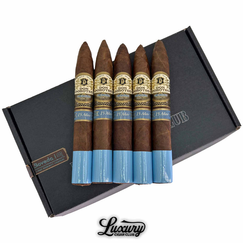 Close-up of Don Doroteo El Alcalde Aged 15 Years Torpedo 5-pack highlighting gold and blue cigar bands and rich wrapper texture, presented by Luxury Cigar Club.