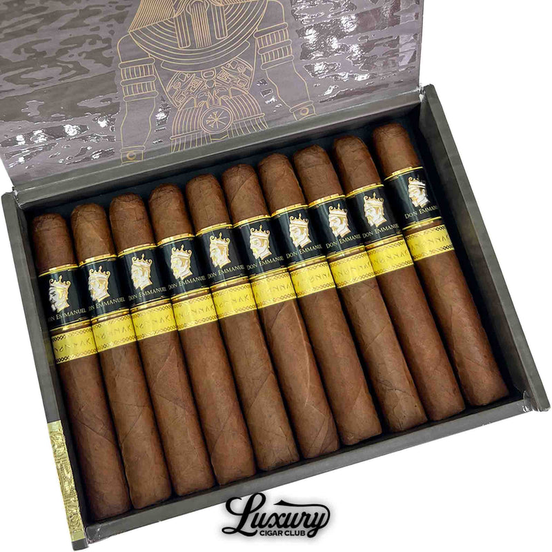 Close-up of an open box of Don Emmanuel Anunnaki Anu cigars featuring gold and black bands with crown design, presented for Luxury Cigar Club.
