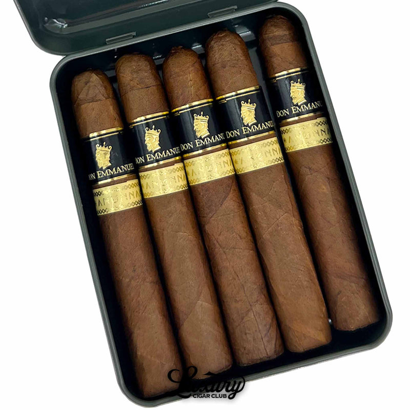 Close-up of Don Emmanuel Anunnaki Corona Fina tin pack showing five cigars with gold and black bands arranged neatly inside, part of Luxury Cigar Club.