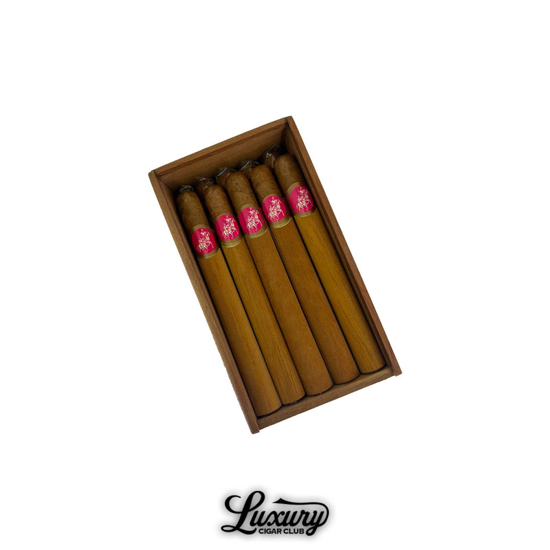 Open box of Don Quijote Churchill cigars with light brown wrappers and pink bands, neatly arranged in wooden box, Luxury Cigar Club logo