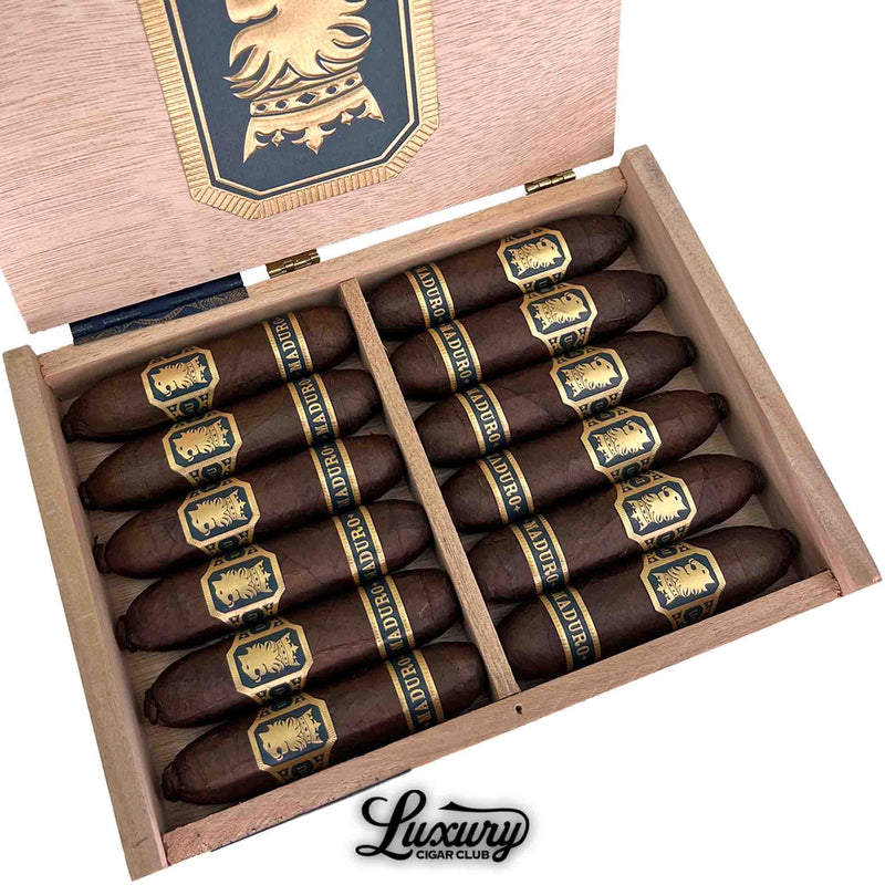 Close-up of Drew Estate Undercrown Maduro Flying Pig cigars in their box, highlighting rich Maduro wrappers and detailed gold accents, featured by Luxury Cigar Club.