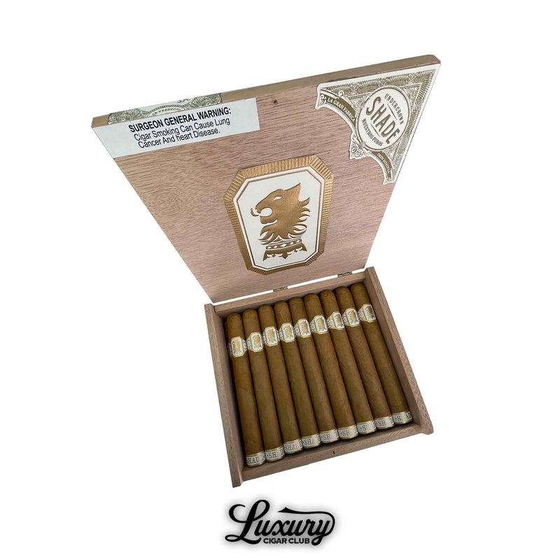 Drew Estate Undercrown Shade Corona Doble cigars arranged neatly in their box with refined Connecticut Shade wrappers and gold lion accents, presented by Luxury Cigar Club.