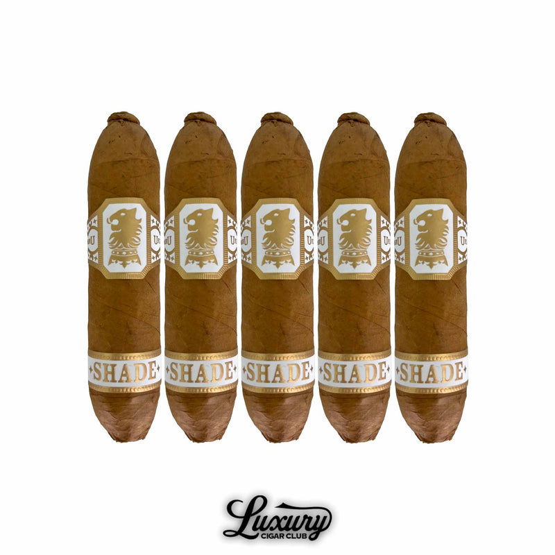 Five-pack of Drew Estate Undercrown Shade Flying Pig cigars with elegant gold and white bands, highlighting smooth Connecticut Shade wrappers, available at Luxury Cigar Club.