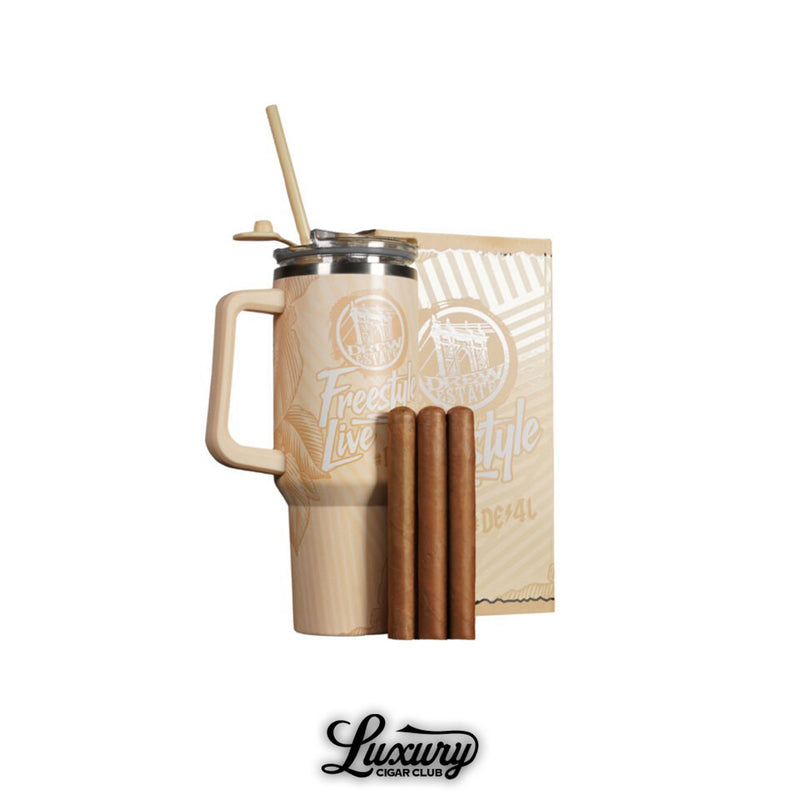 Drew Estate Freestyle Live Kit featuring a beige travel mug with straw, branded packaging, and three premium cigars, presented by Luxury Cigar Club.