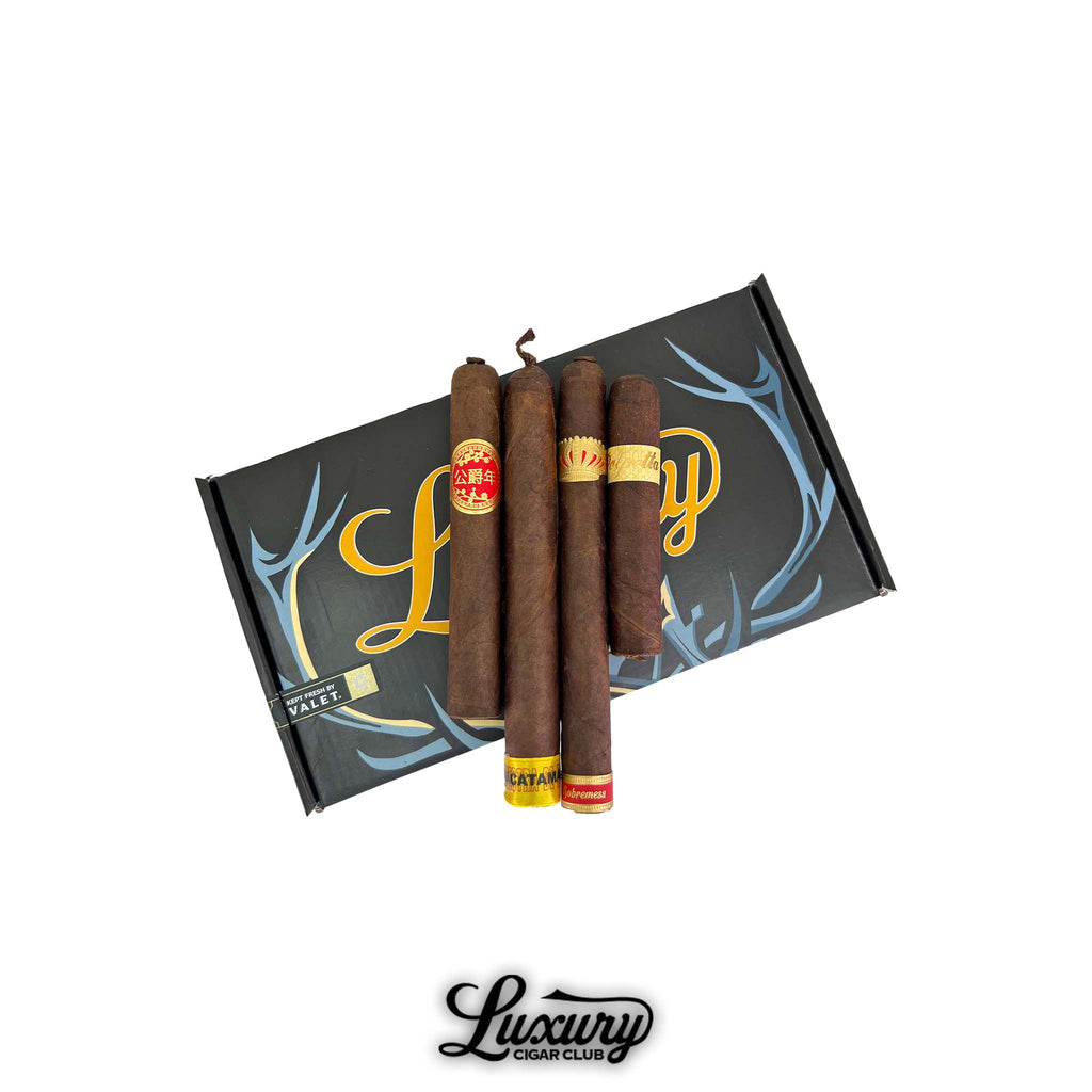 Dunbarton Tobacco & Trust Duque 7th Anniversary Sampler featuring four premium cigars displayed on Luxury Cigar Club packaging.