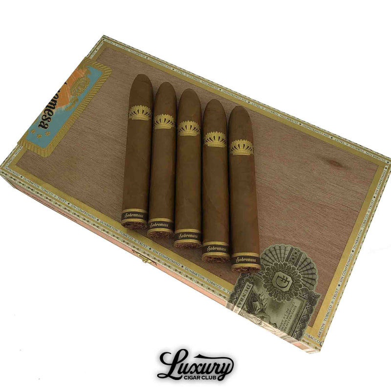 Five Dunbarton Tobacco & Trust Sobremesa Brûlée Gordo cigars resting on a cedar box with gold detailing, smooth Connecticut shade wrappers, available at Luxury Cigar Club