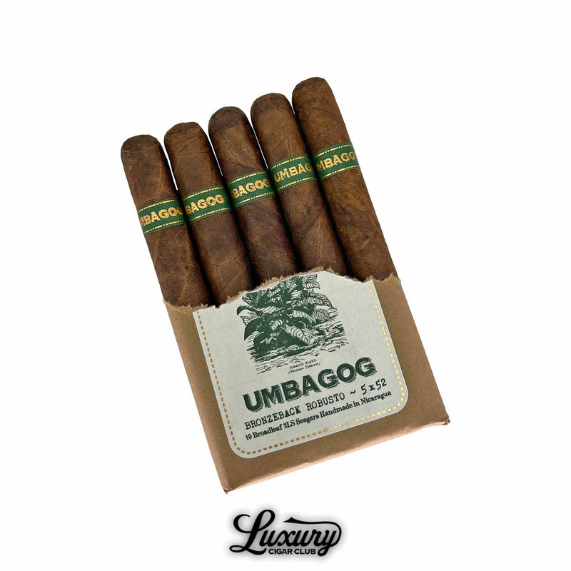 Dunbarton Tobacco & Trust Umbagog Bronzeback Robusto Cigars Partially Open Pack. Open brown paper-wrapped bundle displaying five cigars with dark brown wrappers and green-and-gold “Umbagog” bands, showing the label with plant illustration.