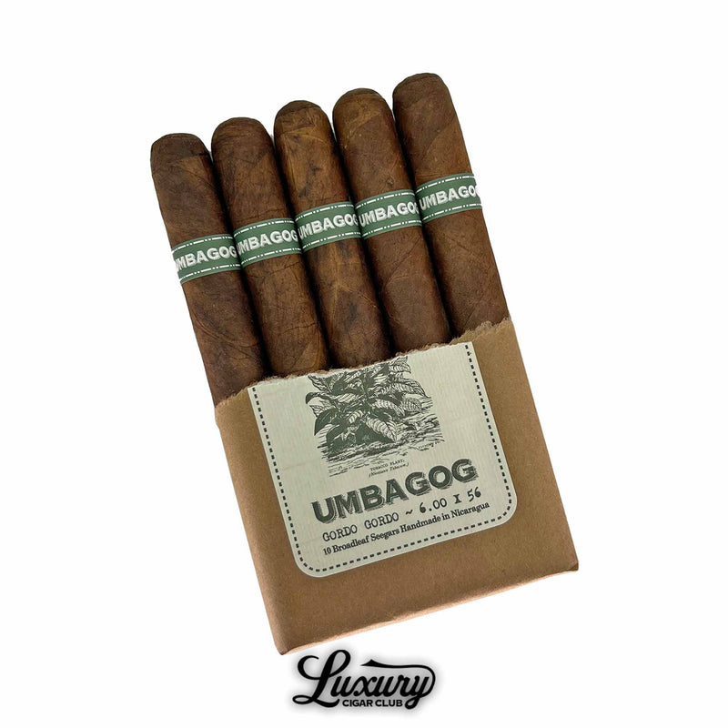 Dunbarton Tobacco & Trust Umbagog Gordo Gordo 5-pack. Five Umbagog Gordo Gordo cigars partially unwrapped from brown paper bundle, each with a green and white band.