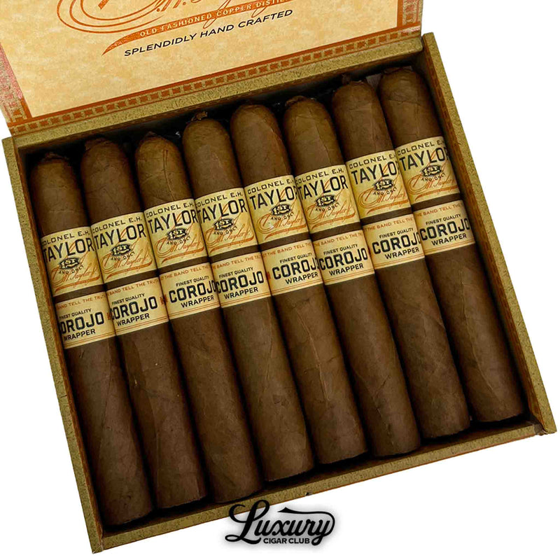 Close-up of Colonel E.H. Taylor Corojo Corona cigars inside open box highlighting Corojo wrapper and branding details, Luxury Cigar Club branding.