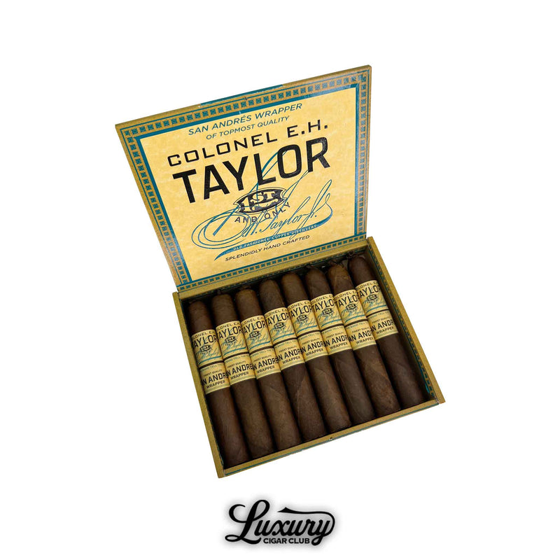 Open box of Colonel E.H. Taylor San Andres Robusto cigars featuring dark San Andrés wrappers and vintage-inspired yellow and blue packaging, handcrafted with premium tobaccos – Luxury Cigar Club.