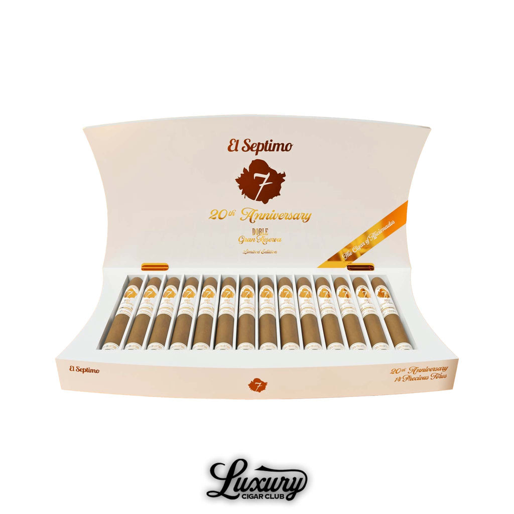 El Septimo 20th Anniversary Doble Gran Reserva Toro cigars displayed in an elegant white and gold presentation box showing twenty cigars lined in rows with commemorative branding and Luxury Cigar Club watermark.