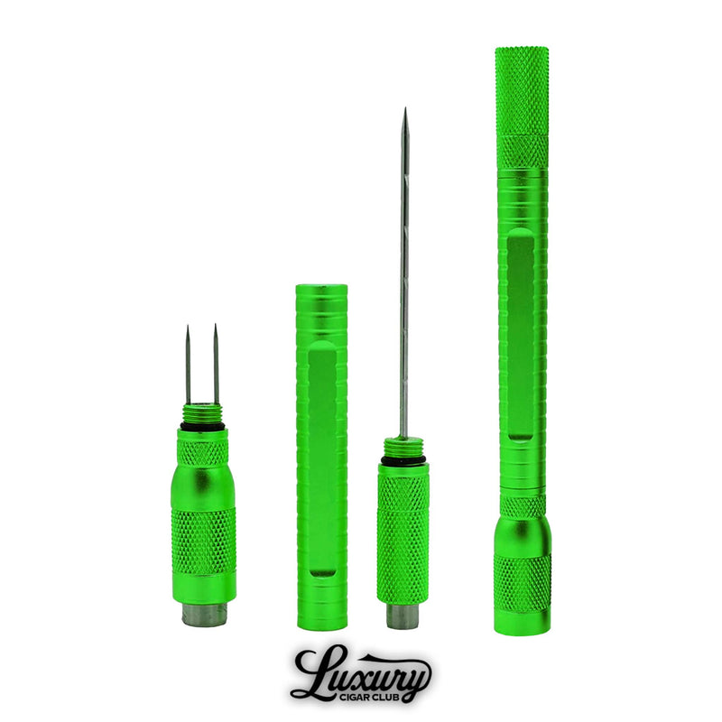 Detailed view of the emerald green cigar puncher stick showing multiple punch heads and accessories for precision cutting.