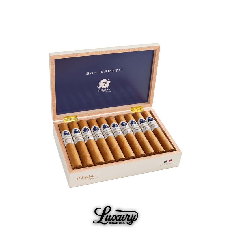 Open box of El Septimo Culinary Arts Collection Bordeaux cigars with navy blue interior lid reading Bon Appetit and twelve light brown cigars arranged inside from Luxury Cigar Club.