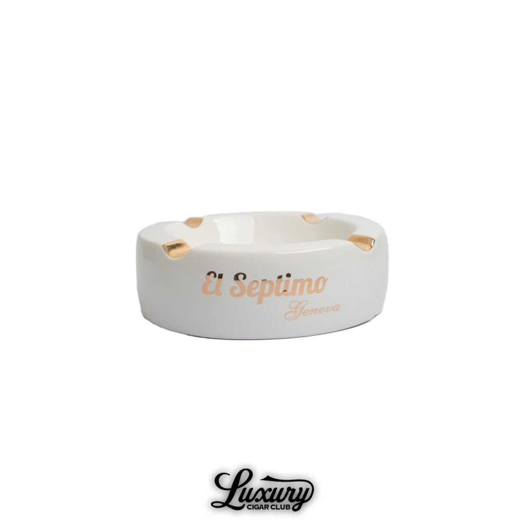 Luxury ceramic cigar ashtray with four gold-trimmed rests, featuring El Septimo Geneva branding.