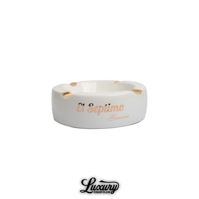 Luxury ceramic cigar ashtray with four gold-trimmed rests, featuring El Septimo Geneva branding.