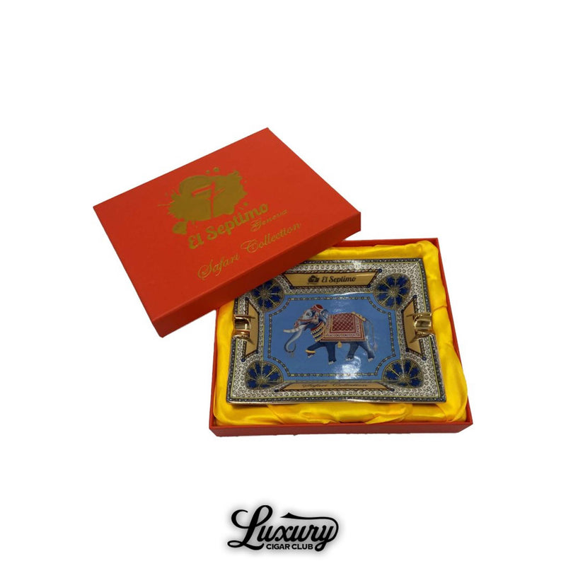 Luxury rectangular cigar ashtray featuring a detailed elephant design, gold accents, and ornate border, presented in a red El Septimo gift box with yellow satin lining.