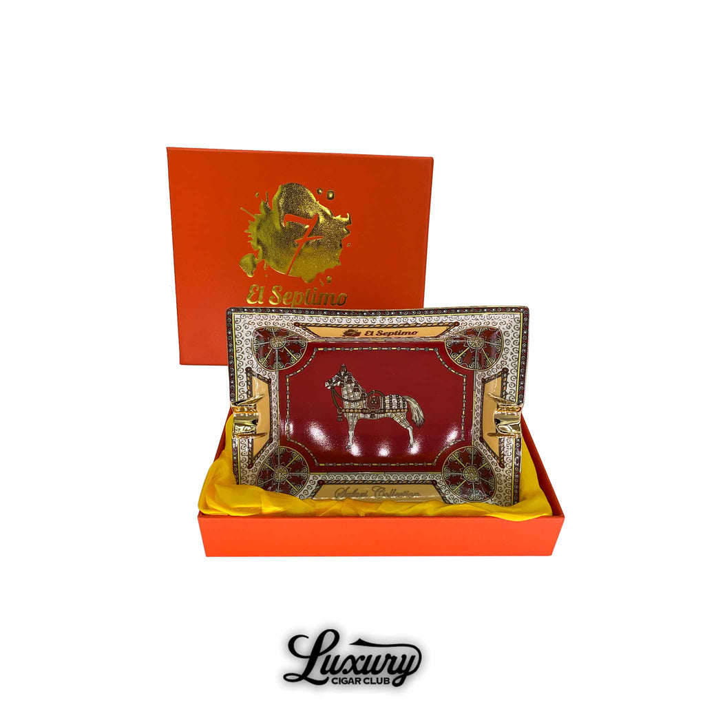 Exclusive red cigar ashtray with stallion artwork, ornate gold accents, and decorative edge, housed in a red and gold El Septimo Safari Collection box.