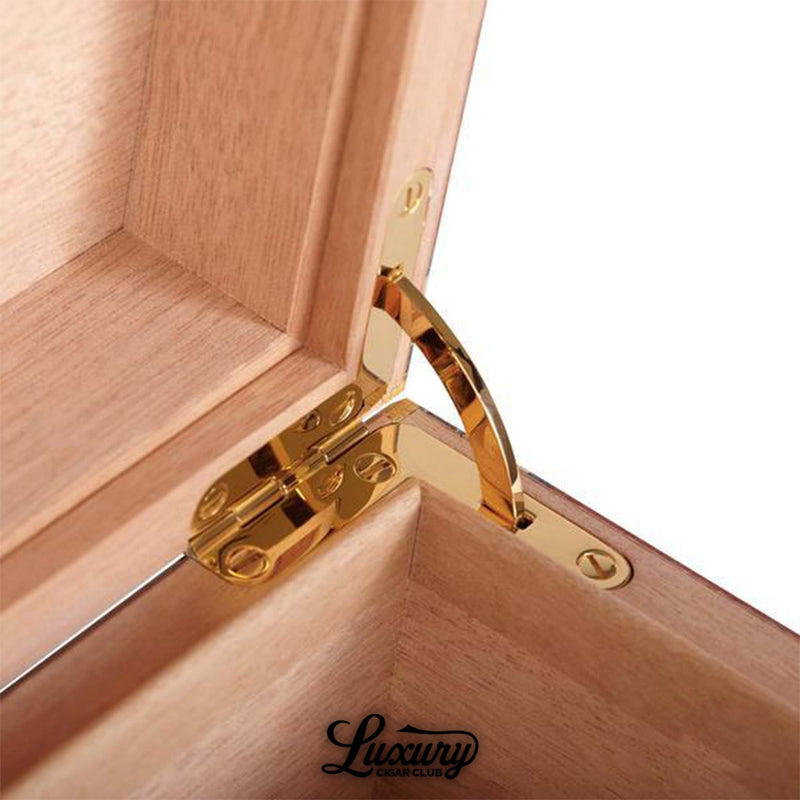 Interior close-up of Elie Bleu Classic Humidor showing gold-plated hinge and fine Spanish cedar craftsmanship, featured by Luxury Cigar Club.