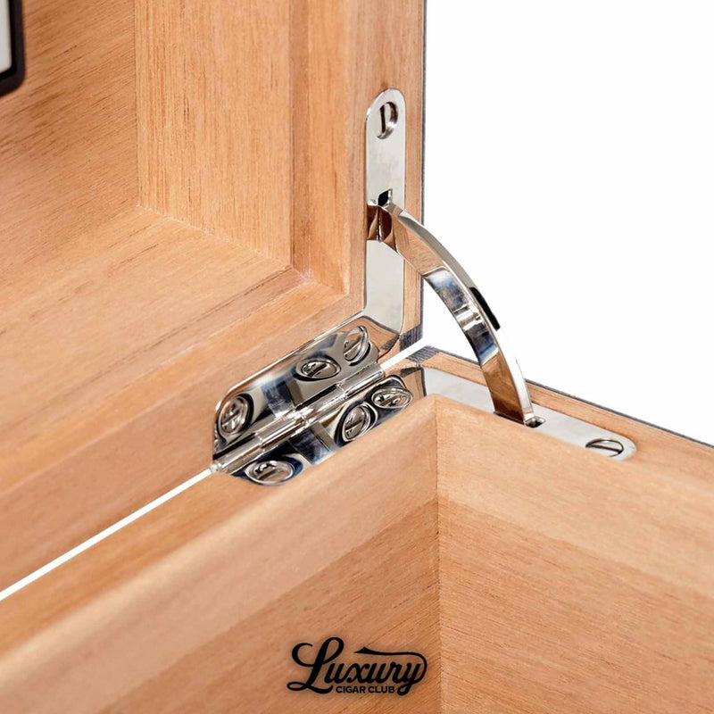 Close-up of Elie Bleu Fruit Humidor’s polished silver hinge and cedar wood craftsmanship, highlighting luxury precision and durability, from Luxury Cigar Club.