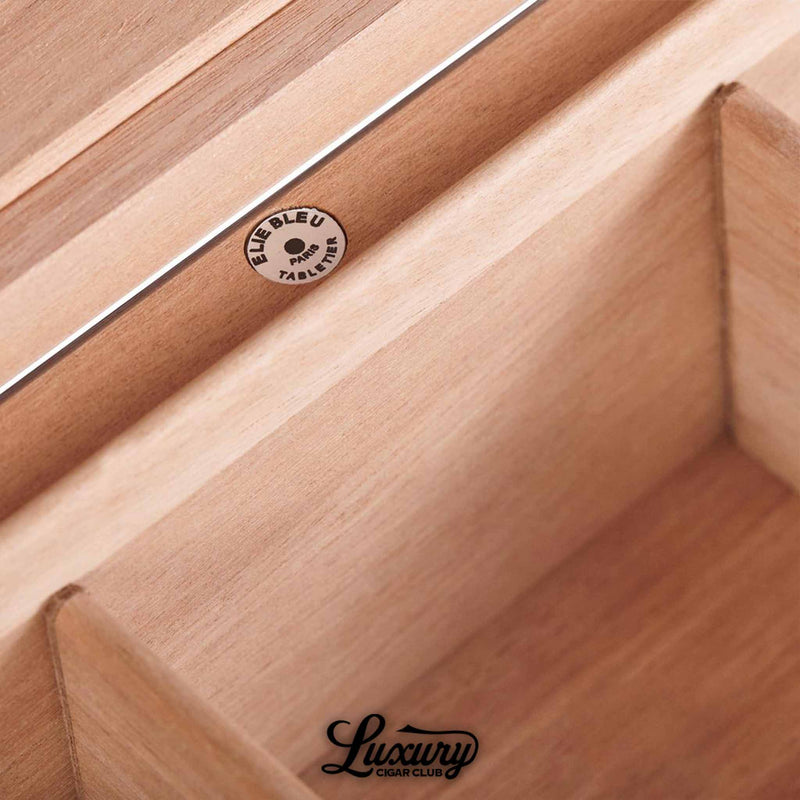 Interior detail of Elie Bleu Fruit Humidor showing smooth cedar lining and Elie Bleu Paris engraving, representing premium cigar storage quality, by Luxury Cigar Club.