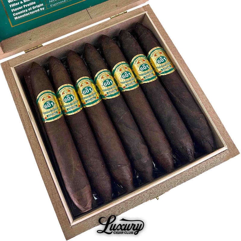 Close-up of Espinosa 601 Green Oscuro La Punta cigars showcasing dark Oscuro wrappers and green-and-gold bands, featured by Luxury Cigar Club.
