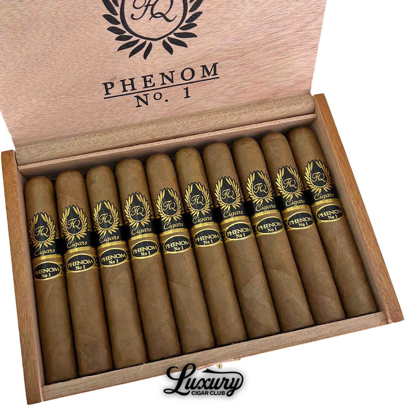 Close-up of FQ Phenom No. 1 Robusto cigars neatly arranged in a wooden box, showcasing gold laurel-accented black bands and smooth Connecticut wrappers. Luxury Cigar Club logo beneath.