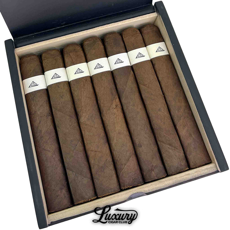 Close up detailed view of Fable Fourth Prime Machu cigars inside box, showcasing uniform dark wrapper color, box pressed format and white triangle band design.