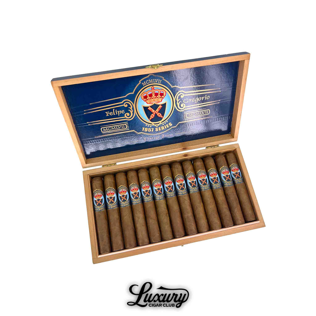 Felipe Gregorio 1957 Series FG50 cigars displayed in an open box with royal blue interior and bold gold detailing, offered by Luxury Cigar Club.