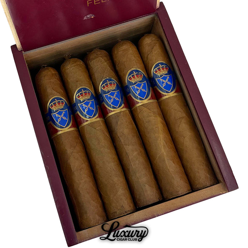 Close-up view of Felipe Gregorio Felipe Felipe Magnum 56 cigars in red box with blue and gold bands