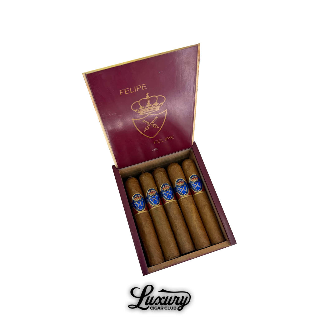 Felipe Gregorio Felipe Felipe Magnum 56 cigars in open red box with gold crest and crown design