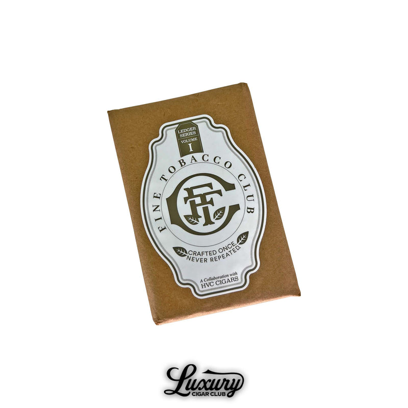 Closed brown pack of Fine Tobacco Club Ledger Series Volume 1 cigars featuring a large white and gold label that reads Crafted Once Never Repeated in collaboration with HVC Cigars displayed with the Luxury Cigar Club logo below